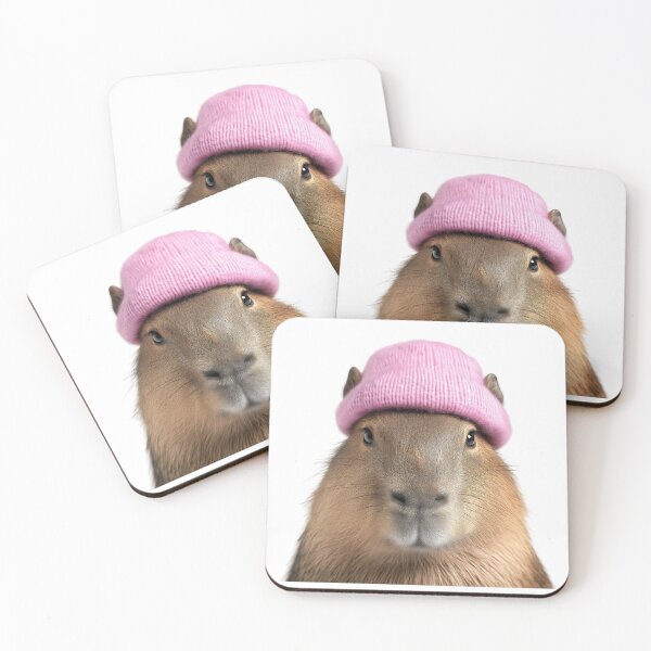 Item preview, Cozy Capybara Wearing Pink Winter Hat Trendy Animal Fashion Artwork designed and sold by LazyOwlStore.