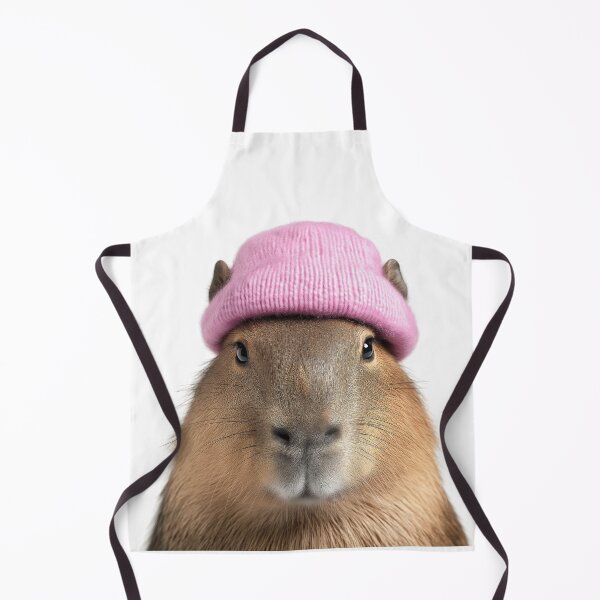Item preview, Cozy Capybara Wearing Pink Winter Hat Trendy Animal Fashion Artwork designed and sold by LazyOwlStore.