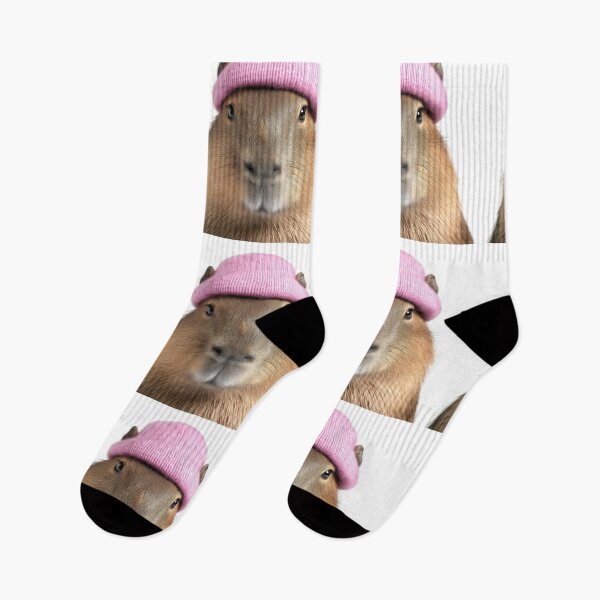 Item preview, Cozy Capybara Wearing Pink Winter Hat Trendy Animal Fashion Artwork designed and sold by LazyOwlStore.