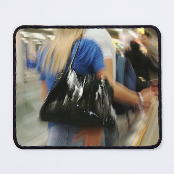 Item preview, Blurred photo of people on electiric walkway in airport designed and sold by Photopat.