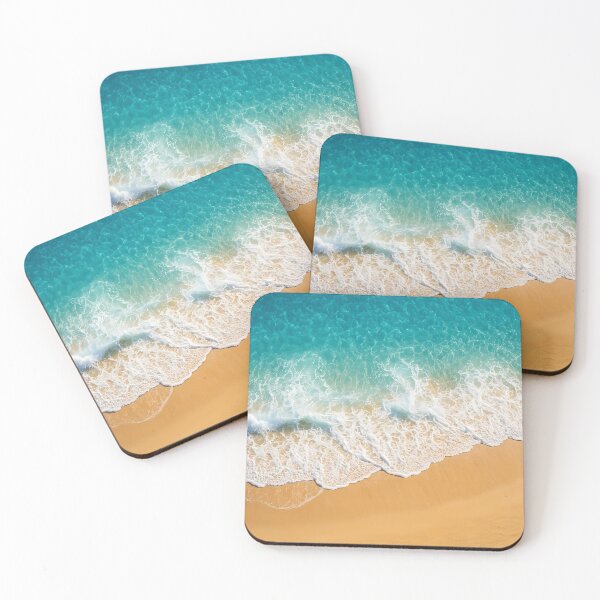 Item preview, Aerial view of a beautiful sandy beach and turquoise ocean with white foamy waves meeting the shore under clear blue water designed and sold by homydesign.
