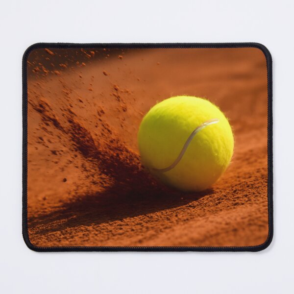 Item preview, A yellow tennis ball rests on a red clay court with dust particles in the air, capturing a moment of action and sport designed and sold by homydesign.