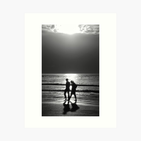 Item preview, Couple walking along a beach at sunset. Black and white. designed and sold by Elena Dijour.