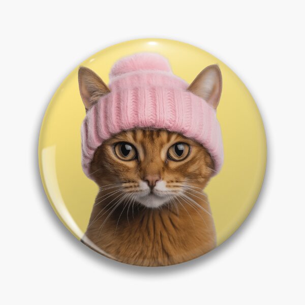 Artikelvorschau, Gemütliche Abessinierkatze mit rosa Wintermütze und trendigem Tiermode-Kunstwerk entworfen und verkauft von LazyOwlStore.