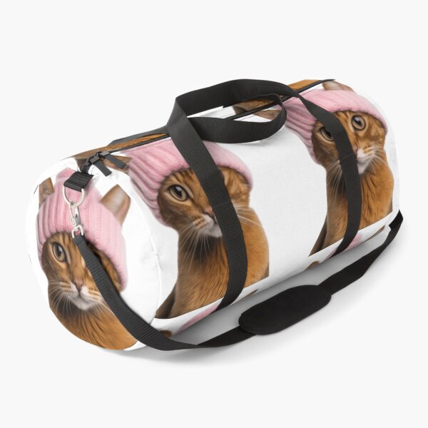 Item preview, Cozy Abyssinian Cat Wearing Pink Winter Hat Trendy Animal Fashion Artwork designed and sold by LazyOwlStore.