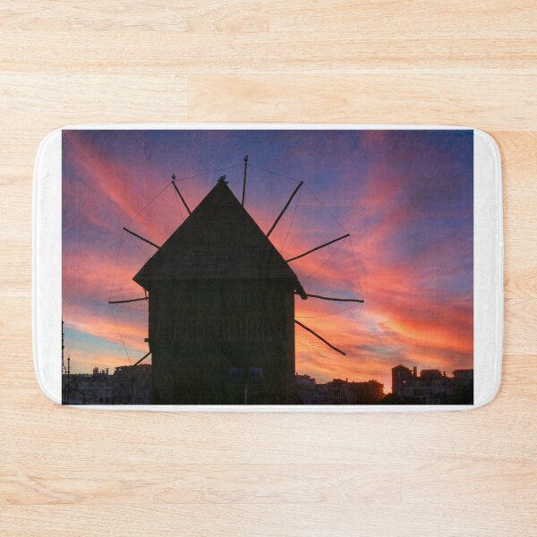 Item preview, Dramatic sunset sky over old windmill in Nessebar, Bulgaria designed and sold by goceris.