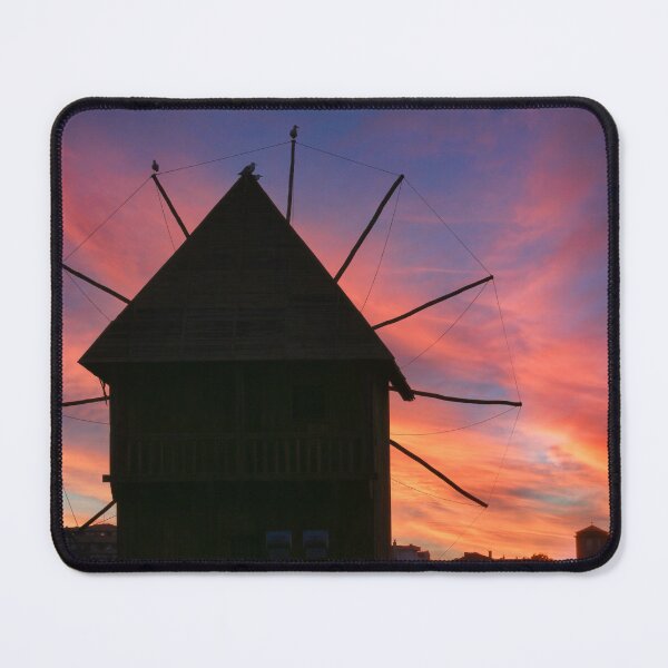 Item preview, Dramatic sunset sky over old windmill in Nessebar, Bulgaria designed and sold by goceris.