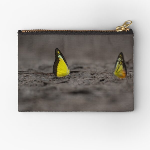 Item preview, This image captures a brightly colored butterfly settled on rugged terrain, offering a striking contrast between fragility and raw earth. designed and sold by DezibyDang.