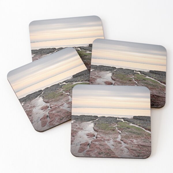 Item preview, Looking out at the Orange and Blue Sky over the Sandstone Rocks in Exmouth Devon Uk designed and sold by Craig Reeves Photography.