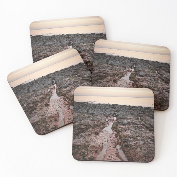 Item preview, Looking out at the Orange Sky over the Sandstone Rocks in Exmouth Devon Uk designed and sold by Craig Reeves Photography.