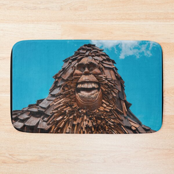 Item preview, Smiling Bigfoot Wood Sculpture Against Blue Sky designed and sold by MichaelPictures.