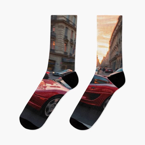 Item preview, Un coche deportivo rojo circula por la ciudad al atardecer designed and sold by CarRends.