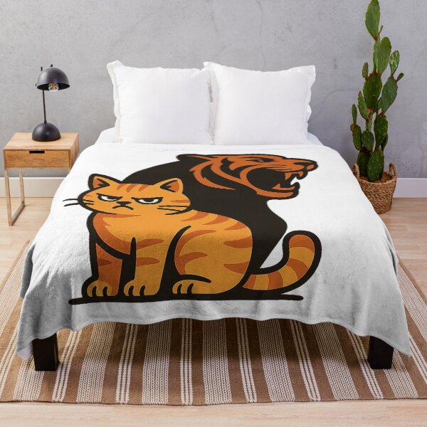 Item preview, an angry orange tabby cat sitting in the foreground with a fierce tiger silhouette as its shadow designed and sold by Ideo Design.