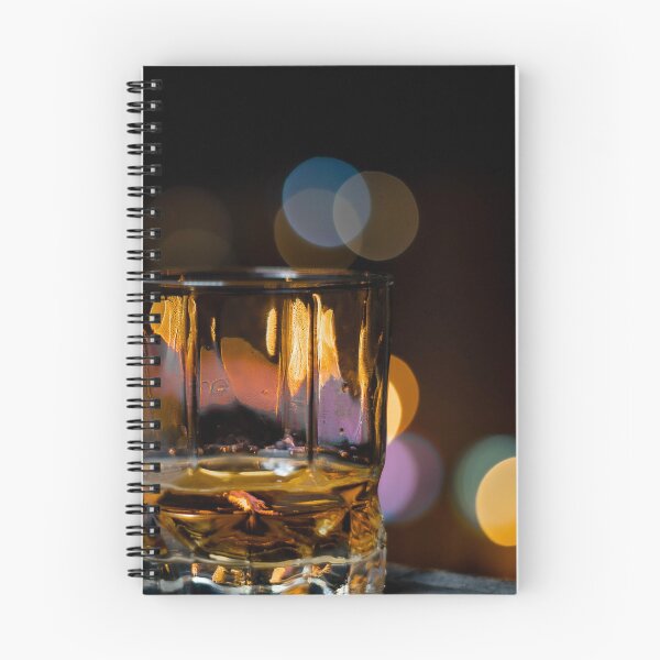 Item preview, Single malt whiskey in a whiskey glass on a summer night with the city bokeh in the background designed and sold by PR7 photography.