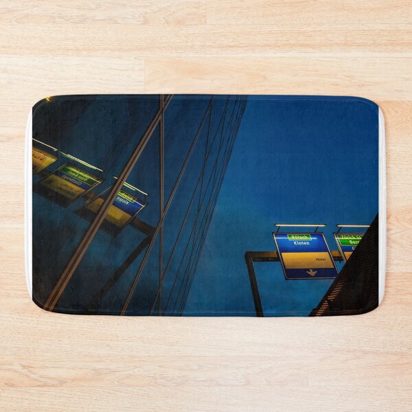 Item preview, Modern Glass Building with Reflection and Illuminated Road Sign to Zurich Airport at Night designed and sold by Mats Silvan.
