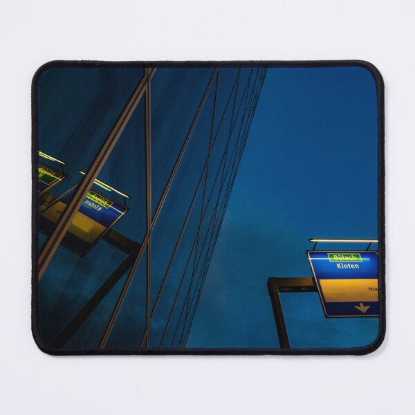 Item preview, Modern Glass Building with Reflection and Illuminated Road Sign to Zurich Airport at Night designed and sold by Mats Silvan.
