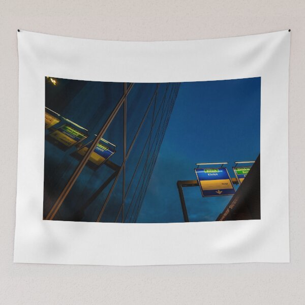 Item preview, Modern Glass Building with Reflection and Illuminated Road Sign to Zurich Airport at Night designed and sold by Mats Silvan.