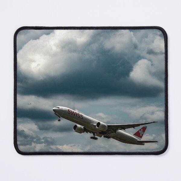 Item preview, Swiss Airlines Passenger Airplane Flying Against Blue Sky and Clouds designed and sold by Mats Silvan.