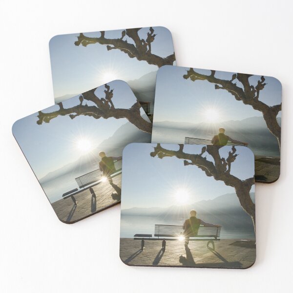 Item preview, Man Sitting on a Bench and Enjoy a Sunset on Lake Maggiore with Mountain View designed and sold by Mats Silvan.