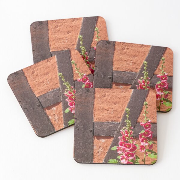 Item preview, Flowering pink hollyhocks in front of a half-timbered wall designed and sold by Torsten  Krüger.
