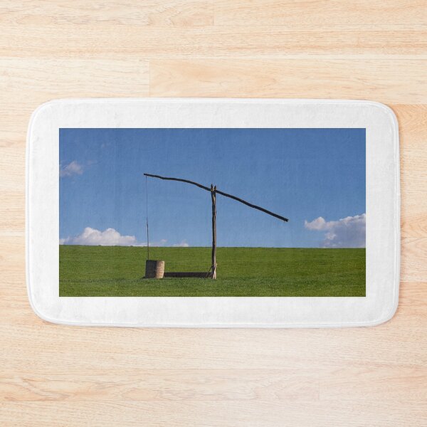 Item preview, Wooden sweep well on a farm with green grass and blue sky designed and sold by PR7 photography.