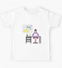 Girl sitting at the table and working on laptop. Kids Tee