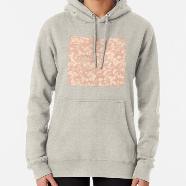 peach colored sweatshirt