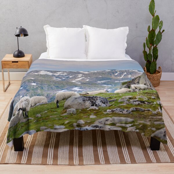 Item preview, Sheep Grazing on Rocky Meadow with Snow-Capped Mountain – Norway designed and sold by TheNordicNature.