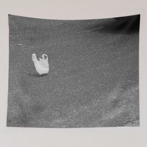 Item preview, white plastic bag flying over the asphalt designed and sold by felipequeiroz.