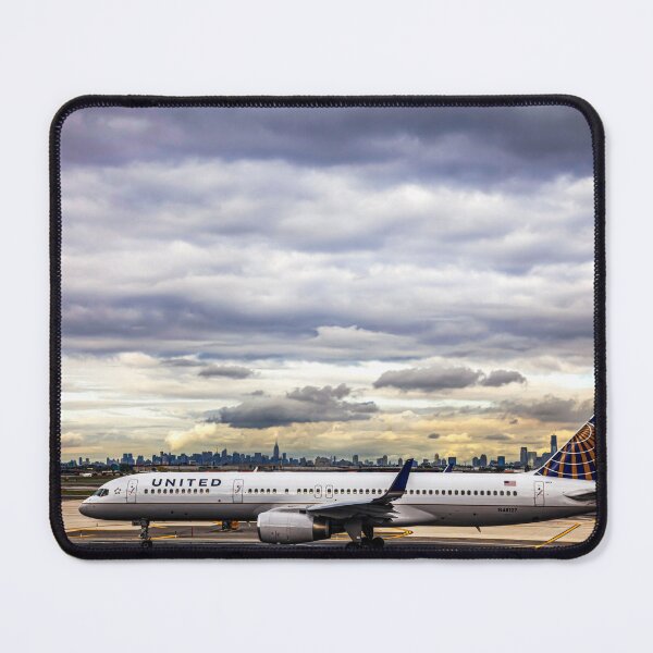 Item preview, United Airlines And Manhattan Skyline At JFK Airport designed and sold by Paul Thompson Photography.