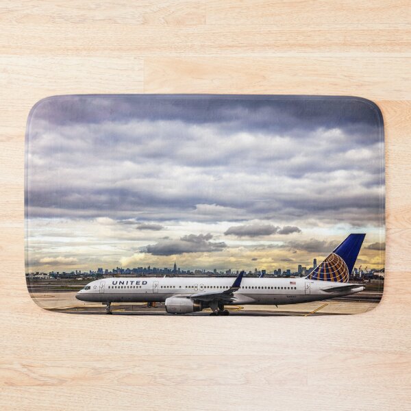 Item preview, United Airlines And Manhattan Skyline At JFK Airport designed and sold by Paul Thompson Photography.