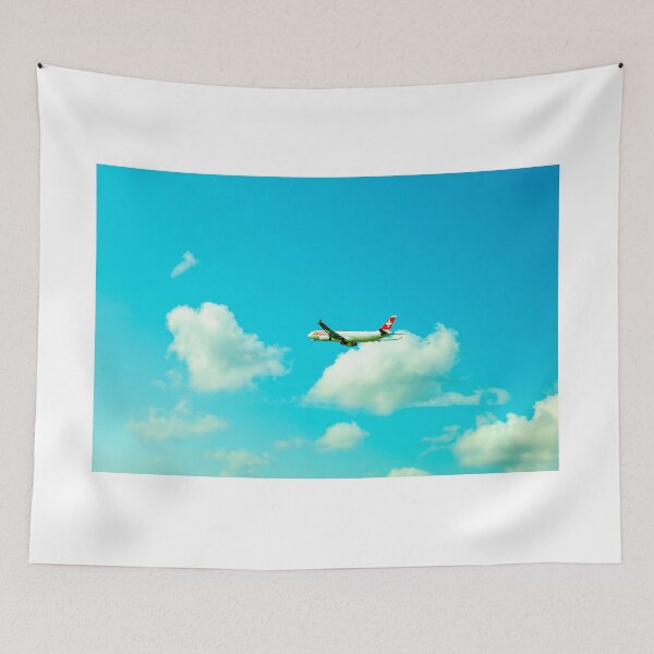 Item preview, Swiss Airlines Passenger Airplane Flying Against Blue Sky and Clouds designed and sold by Mats Silvan.