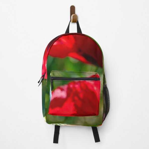 Item preview, Poppy seed pod with blooming red poppy in the background designed and sold by lisavonbiela.