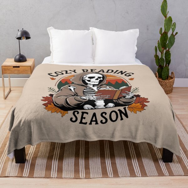Item preview, Cozy Reading Season – Skeleton Autumn Book Lover  designed and sold by NerdyRunner.