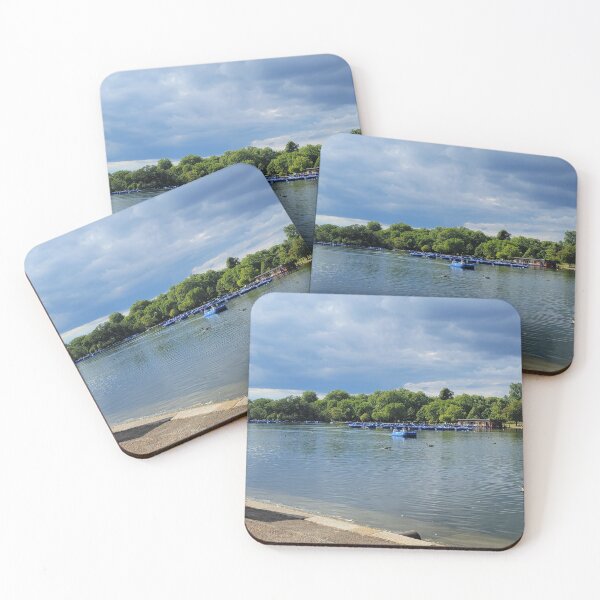 Item preview, Lake bordering green forest with canoes designed and sold by CholiBe.