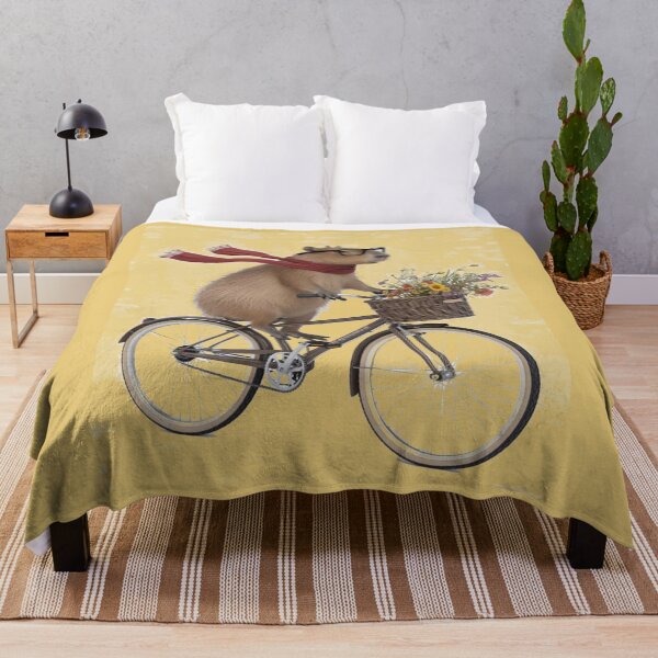 Item preview, Capybara in a red scarf on a bike designed and sold by DZIERANA.