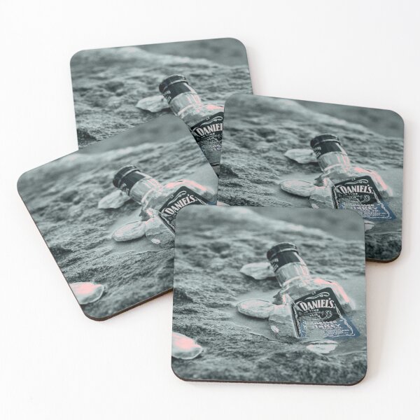 Item preview, shattered whiskey bottle with shells on rocky beach designed and sold by Jenzer83.