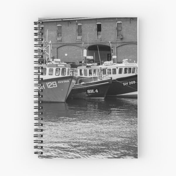 Item preview, Fishing boats moored outside Scarborough fish market in black and white designed and sold by yackers1.