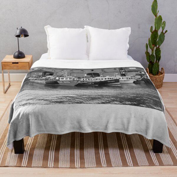 Item preview, Fishing boats moored outside Scarborough fish market in black and white designed and sold by yackers1.