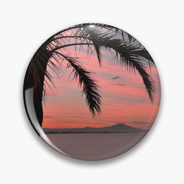 Item preview, Palm tree on the coast of Peñíscola (Spain), with a reddish sky designed and sold by seasandlands.