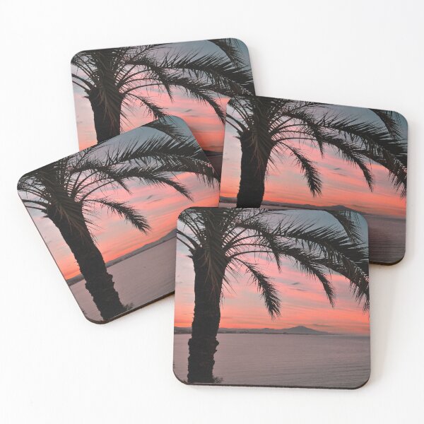 Item preview, Palm tree on the coast of Peñíscola (Spain), with a reddish sky designed and sold by seasandlands.