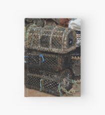 Lobster pots in Paignton harbour Hardcover Journal