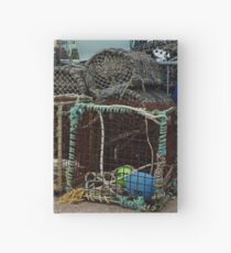 Lobster pots in Paignton harbour Hardcover Journal