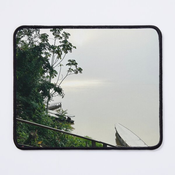Item preview, Canoe in the still amazon river on a Misty morning in the month of June. designed and sold by ninjapineapple.