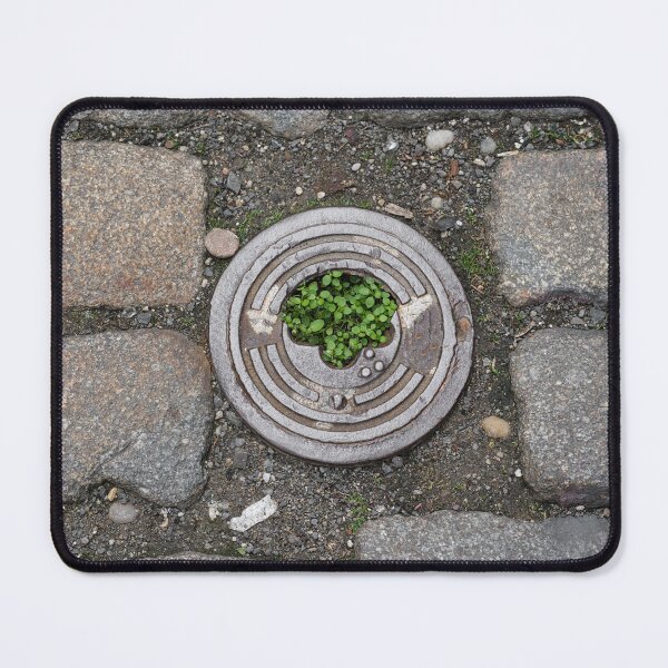Item preview, Urban Nature – Green Plant Growing Through Manhole in Cobblestone Street designed and sold by RastislavS.