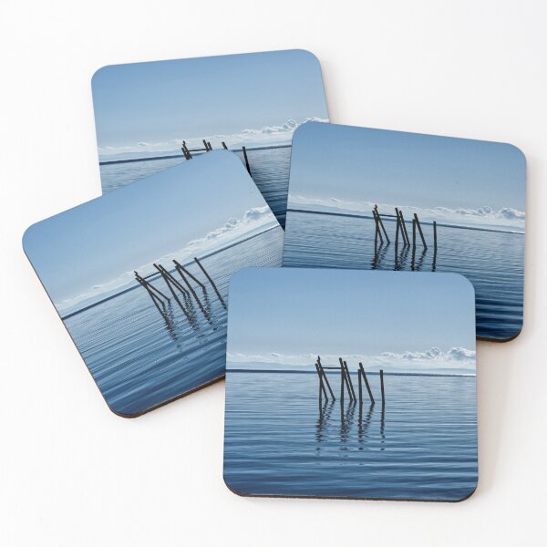 Item preview, Wooden structure in the ocean - mountain silhouette in the background designed and sold by Michaelerch.