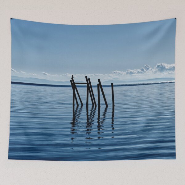 Item preview, Wooden structure in the ocean - mountain silhouette in the background designed and sold by Michaelerch.