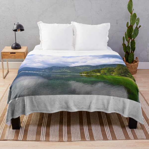 Item preview, Bohinj Lake, Slovenia. Landscape of the lake with green water and mountains in background designed and sold by goceris.