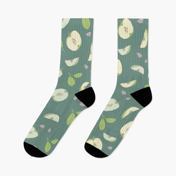 Item preview, Halves of apples on a green background designed and sold by Lenamakina.