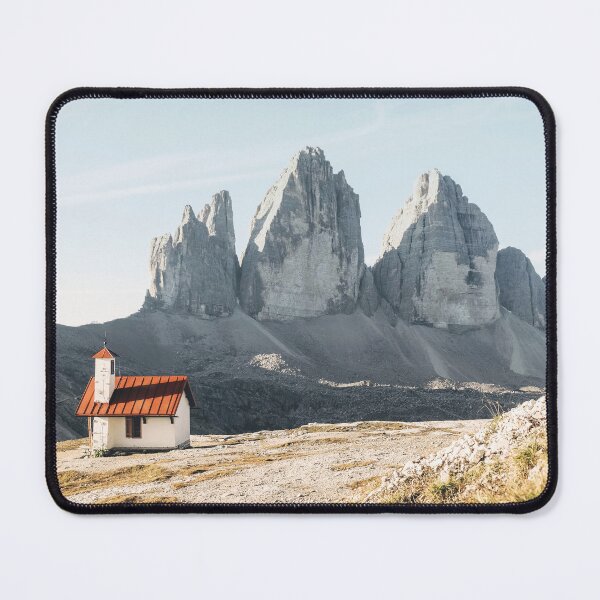 Item preview, Dolomites, Italy I Isolated church in front of the Alps mountain peaks of the Tre Cime di Lavaredo for a panorama view of an imposing rock nature landscape in the pastel soft light of sunrise sunset designed and sold by Julie Travel Photography.